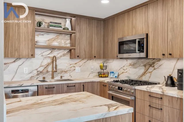 Modern walnut kitchen with marble countertops