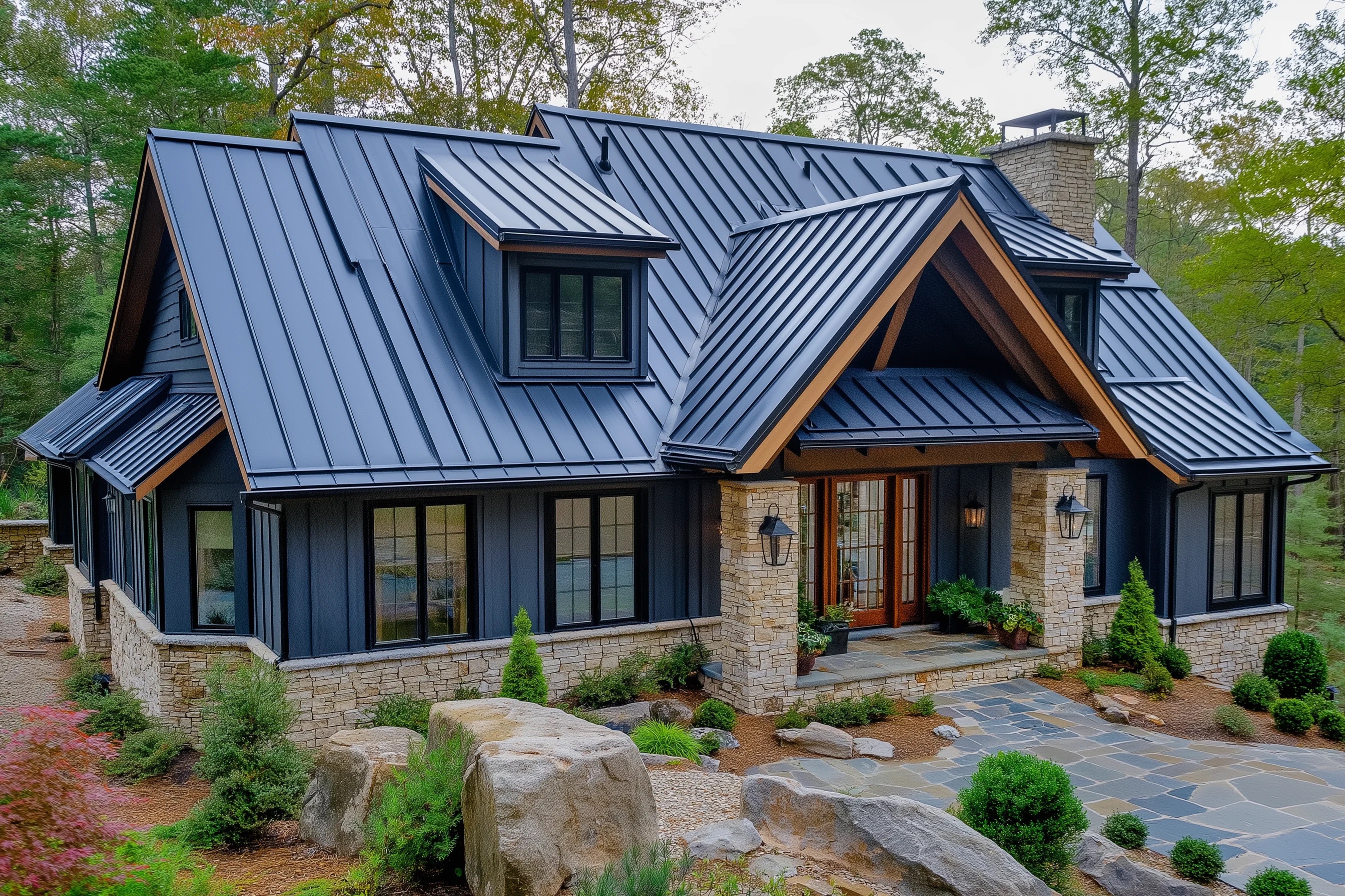Craftsman home with standing seam metal roof and natural stone accents