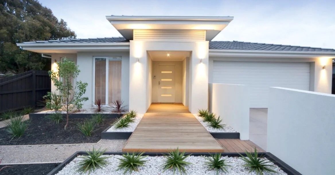 Contemporary entrance with timber walkway and landscaping